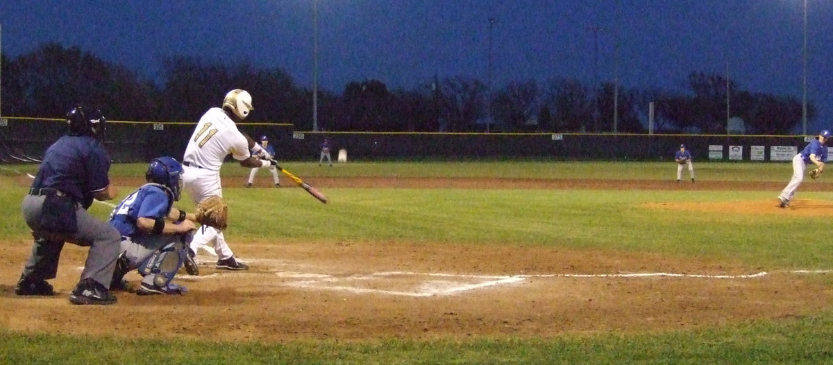 Image: Anderson hits it long — Another hit gone into the outfield by Jasenio Anderson.