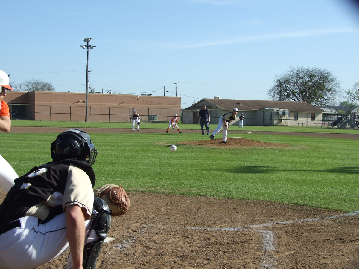 Image: Caden warms up — Freshman pitcher, Caden Jacinto, warms up, along with junior catcher, Ryan Ashcraft.  The Gladiators took on the Avalon Eagles and the Grand Prairie Advantage Eagles in district play.