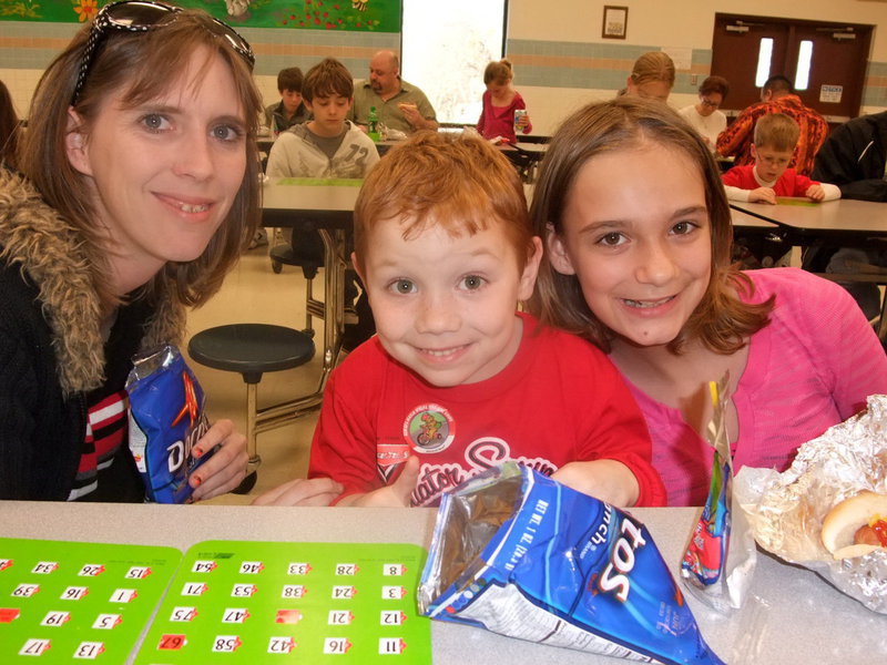 Image: The Svehlak Family — Kelly, Nicolas and Cassidy Svehlak were having a great time playing and enjoying the hotdog meal.