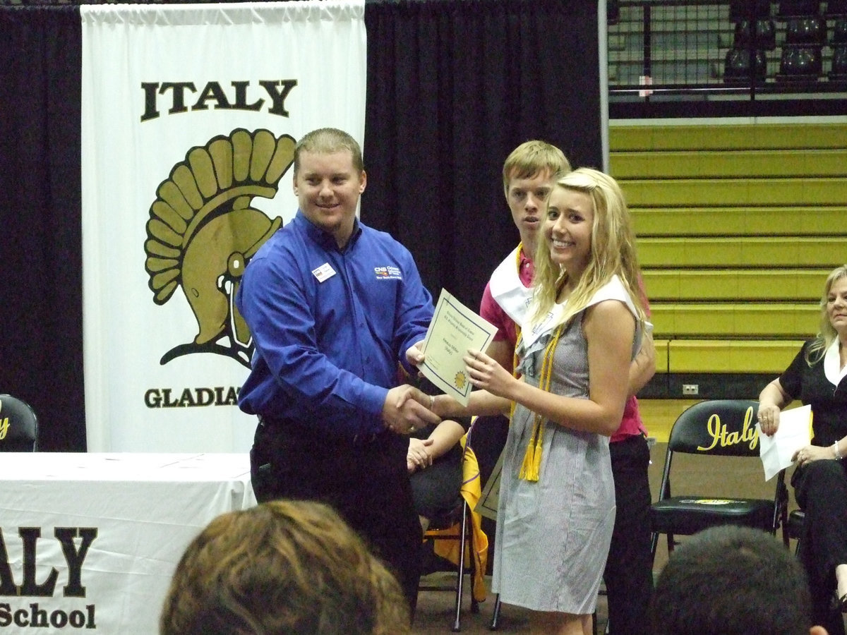 Image: M. E. Singleton Scholarship — CNB representative, Parker Reeves, presented scholarships to Josh Milligan and Lexie Miller.