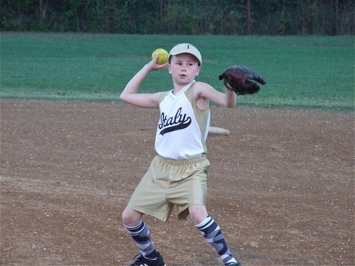 Image: Hooker throws to first — Kimberly Hooker puts in a couple of innings at second base.