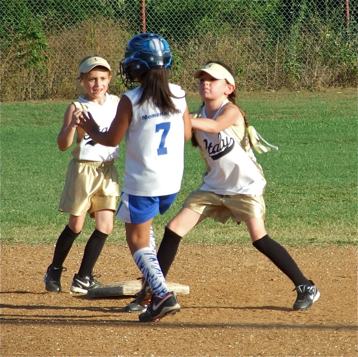 Image: Double denied — Madison Galvan rushes in from centerfield to make the tag as Grace Payne steps back to give Galvan room.