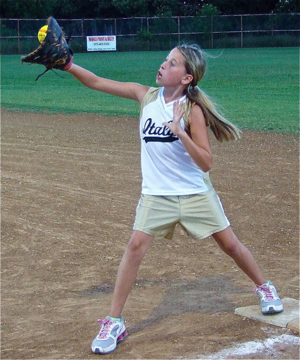 Image: Runner’s out! — Reliable first baseman Hannah Haight makes the catch for an out against Whitney.