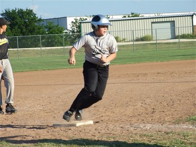 Image: Tyler takes off — Tyler Crawley rounds third base and heads home for a score.