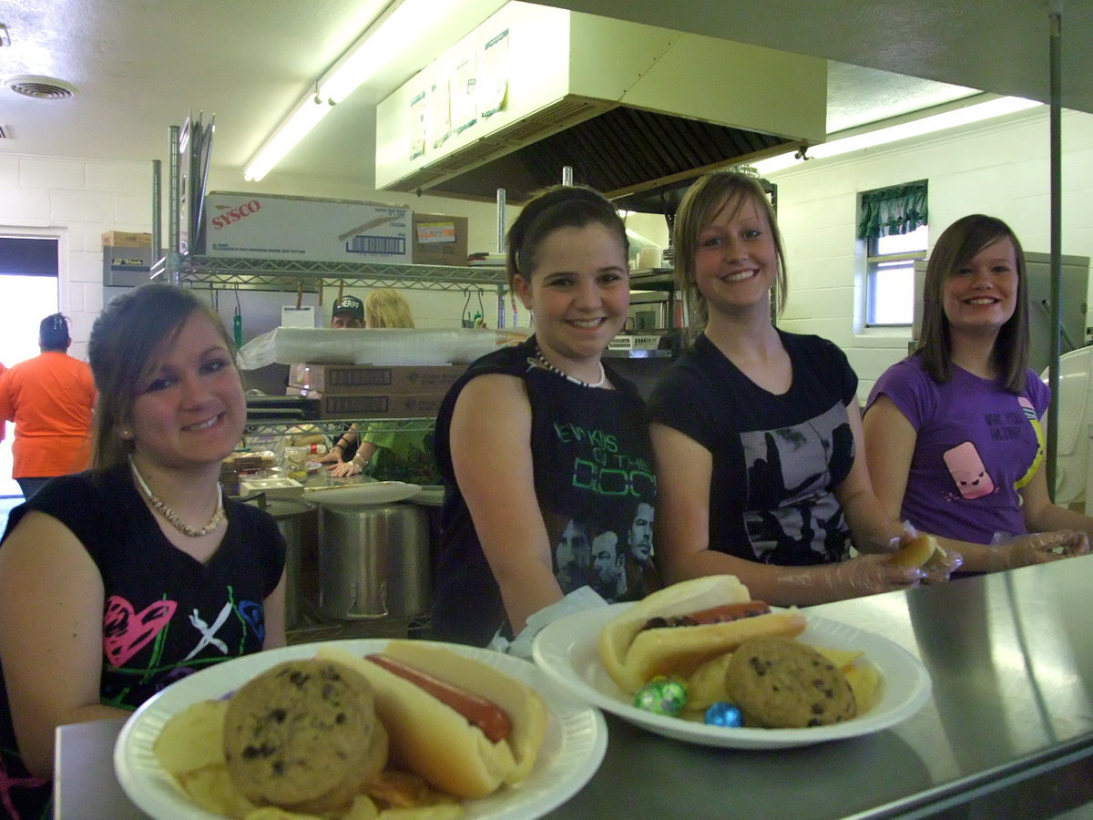 Image: National Junior Honor Society — Mariah Ray, Reagan Adams, Mikalla Wimbish and Morgan Scruggs are Junior Honor Society members earning community service hours serving dinner.