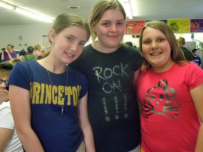 Image: We Are Here! — Samantha Ragland, Jordan Porch and Katy Glenn are all in the fifth grade and were ready to have a good time collecting eggs.