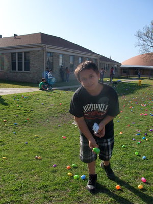 Image: Josh Valdez — Junior National Honor Society member Josh Valdez was busy putting out the eggs for all the kids.