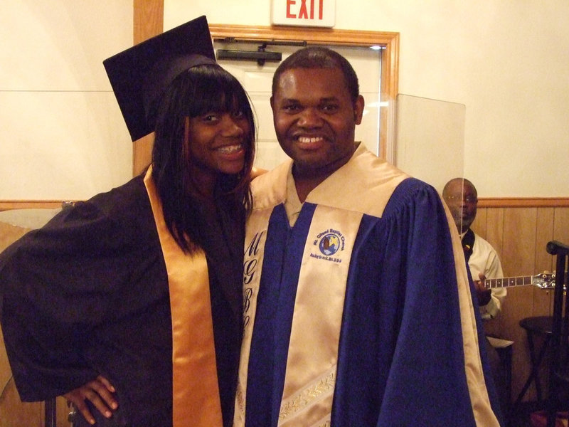 Image: Two peas in a pod — Bryant Cockran and daughter, Shativia, take time for a photo after the services.