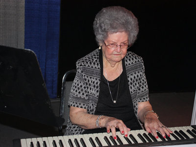 Image: Evelyn Playing the Piano — Evelyn played the piano for her talent.