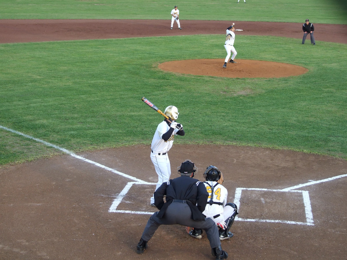 Image: Eagle pitcher tries his best — #23 Salazar from Grand Prairie just can’t send the heat.