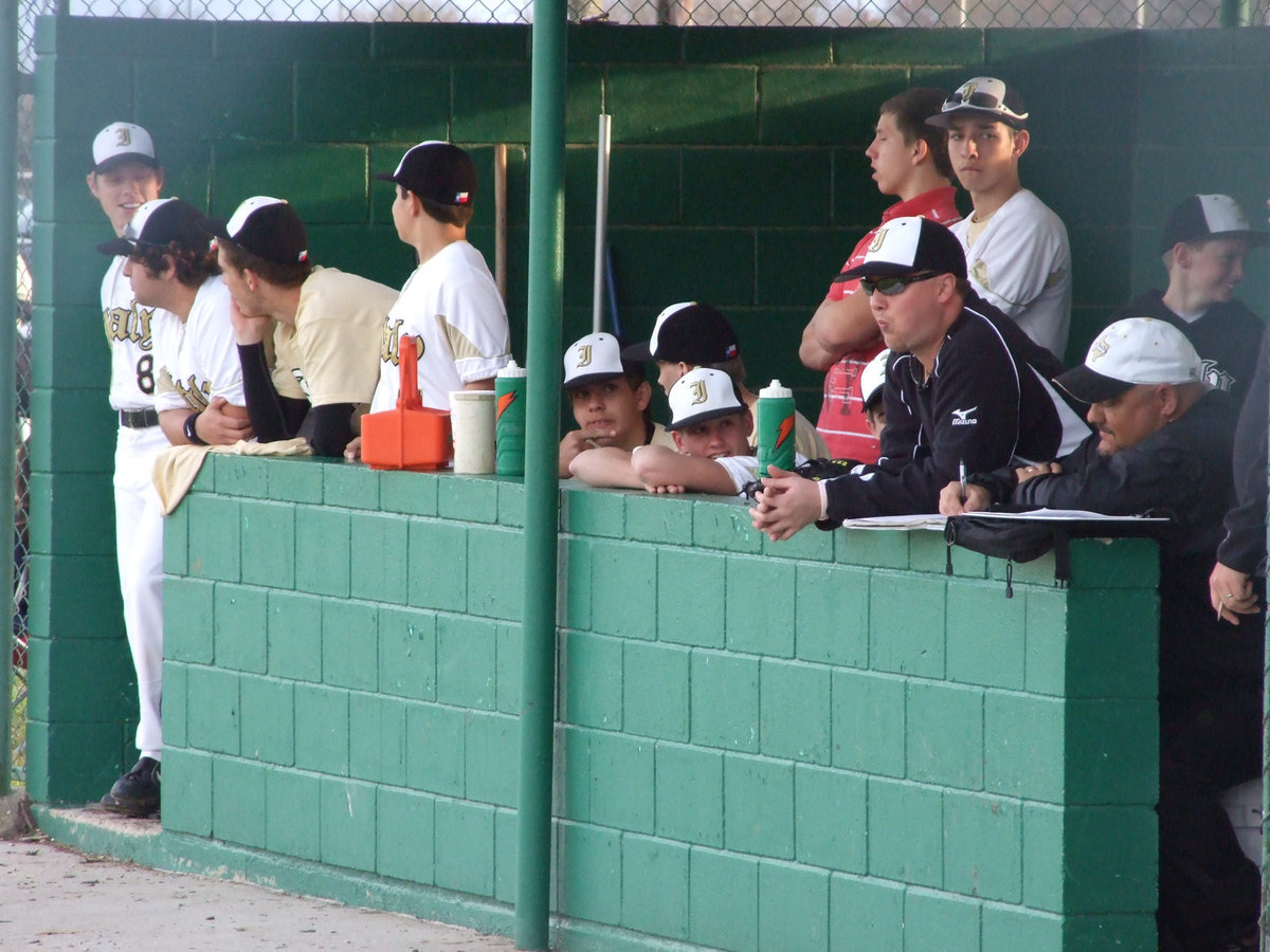 Image: We be watchin’ — Coaches and players watch to see who scores next.