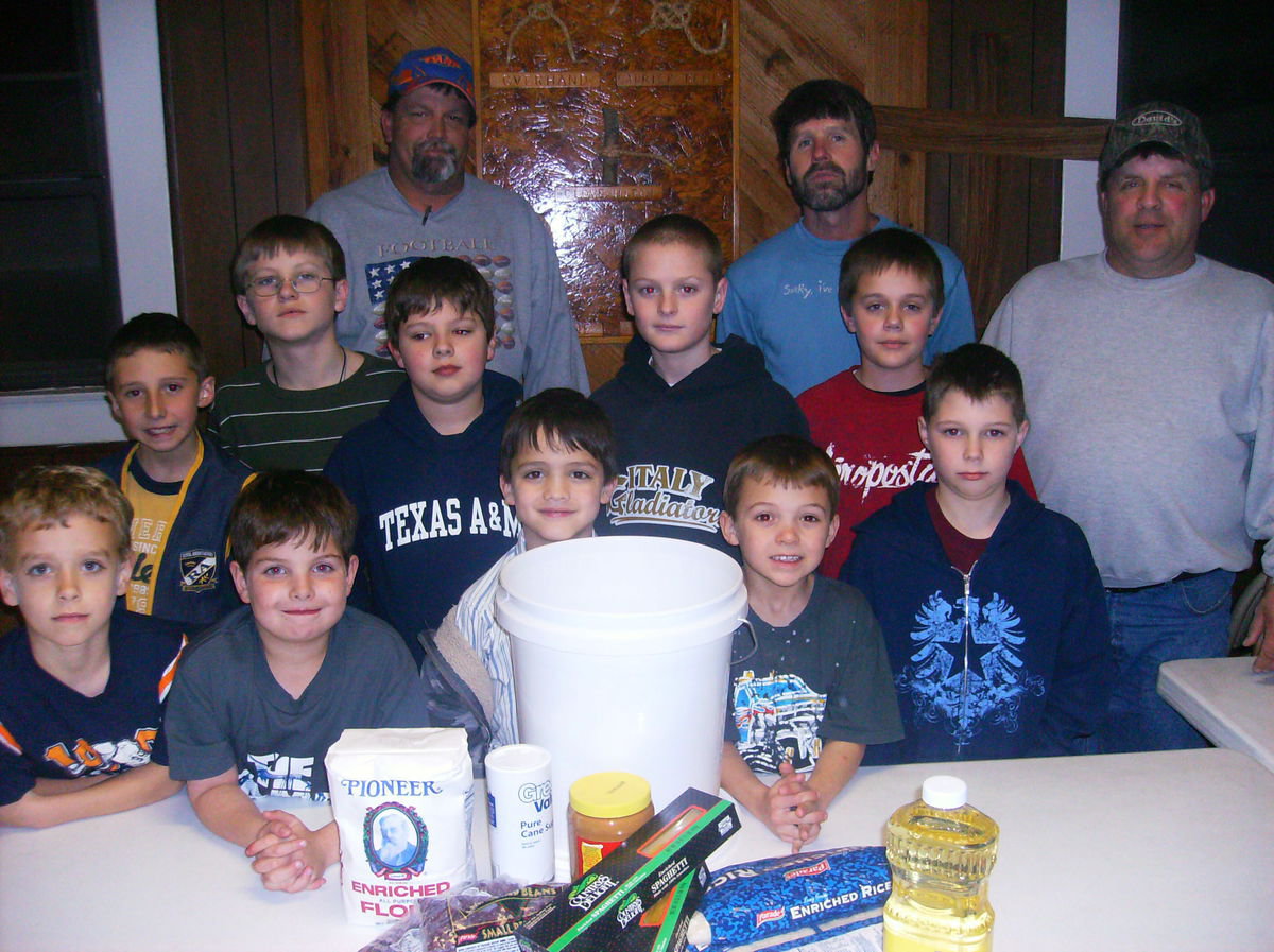 Image: Food for Haiti — The RAs and their leaders filled buckets with flour, creamer, peanut butter, oil, sugar, beans, pasta and peanut butter to send to those in need in Haiti.