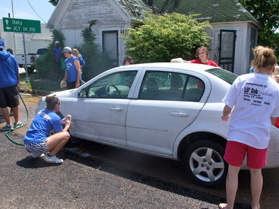 Image: Working Hard — This youth group knew how to wash a car!