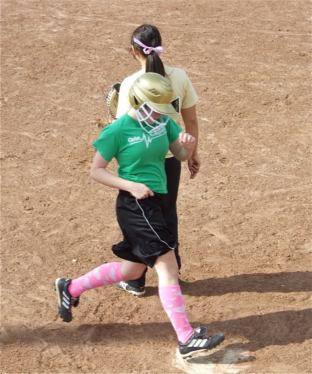 Image: Cassi crosses the plate — Cassi jeffords crosses home plate behind Catcher Alyssa Richards during the lady Gladiators’ Monday practice session.