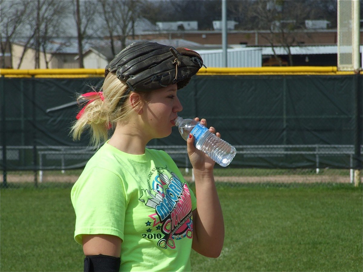 Image: Good day for a cap — For Megan Richards, her glove will work just fine.