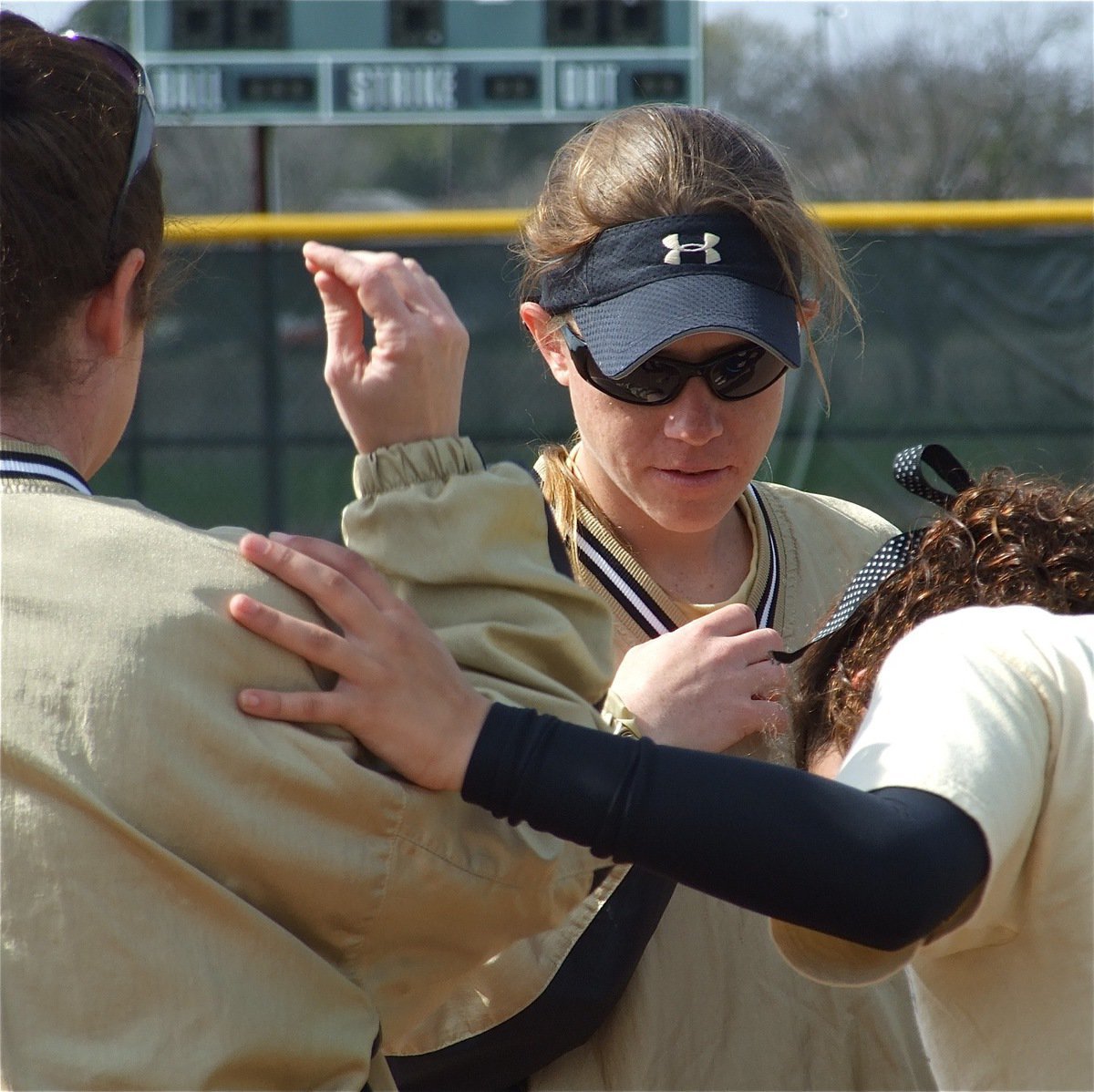 Image: Ouch! — Coaches Andrea Windham and Jennifer Reeves check out the battle scar on Anna Viers.