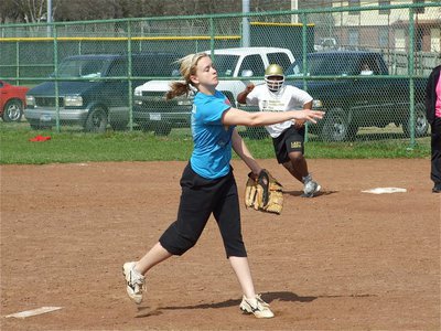 Image: Westbrook pitches — Courtney Westbrook releases a pitch while teammate Sa’Kendra Norwood heads for 2nd base.