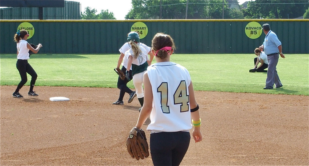 Image: Bailey in centerfield — Bailey Bumpus had an exceptional day in centerfield for the Lady Gladiators snagging several fly balls while on the run.