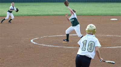 Image: Courtney hits — Courtney Westbrook tries to hit her way onto first base.