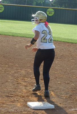 Image: Megan advances — Megan Richards singles in game one and then advances to second base.