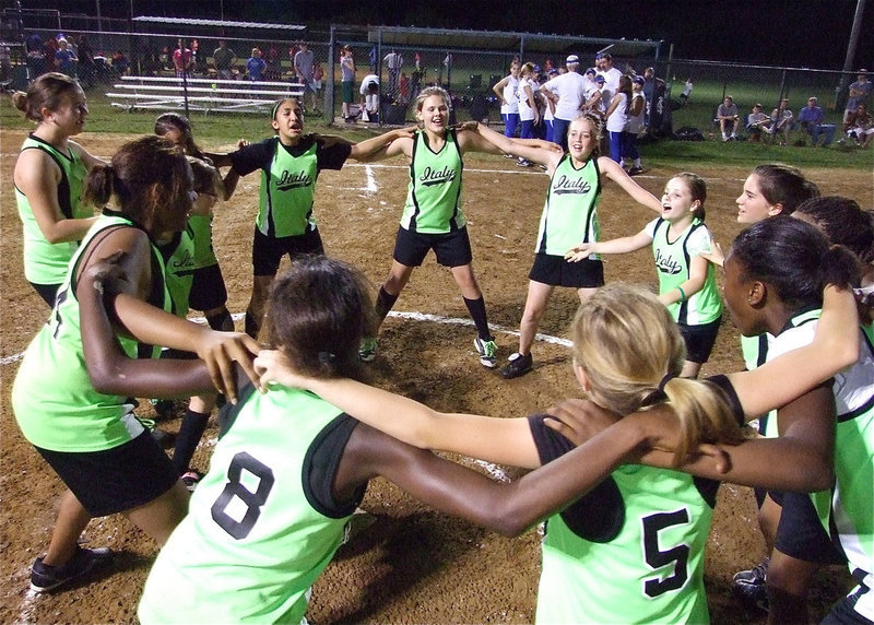 Image: IYAA’s 12u girls softball team forms a victory circle — IYAA’s 12u girls softball team head coached by Michael Chambers celebrate their second win a row after defeating Whitney in Italy at the Upchurch Ball fields.