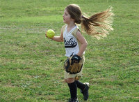 Image: Grace is gorgeous — Tessa South’s T-Ball girls are getting a handle on the game as Grace Patton hustles in with the ball.