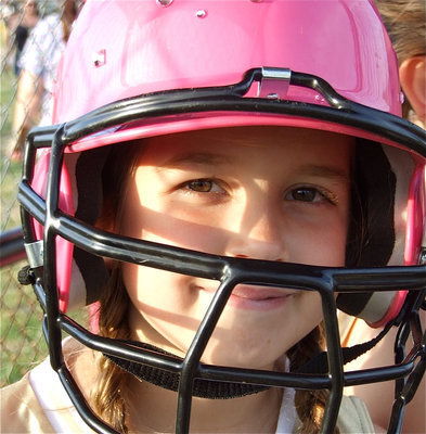 Image: Karley’s ready — Karley Nelson puts on her pink helmet, bats her eyes on then gets ready to bat.