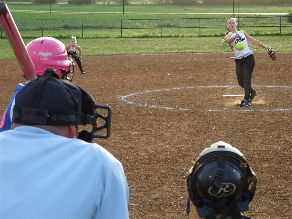 Image: Another in the books — 15u girls softball is undefeated behind the strong arm of pitcher Jaclynn Lewis and the athletic ability of catcher Mary Tate.