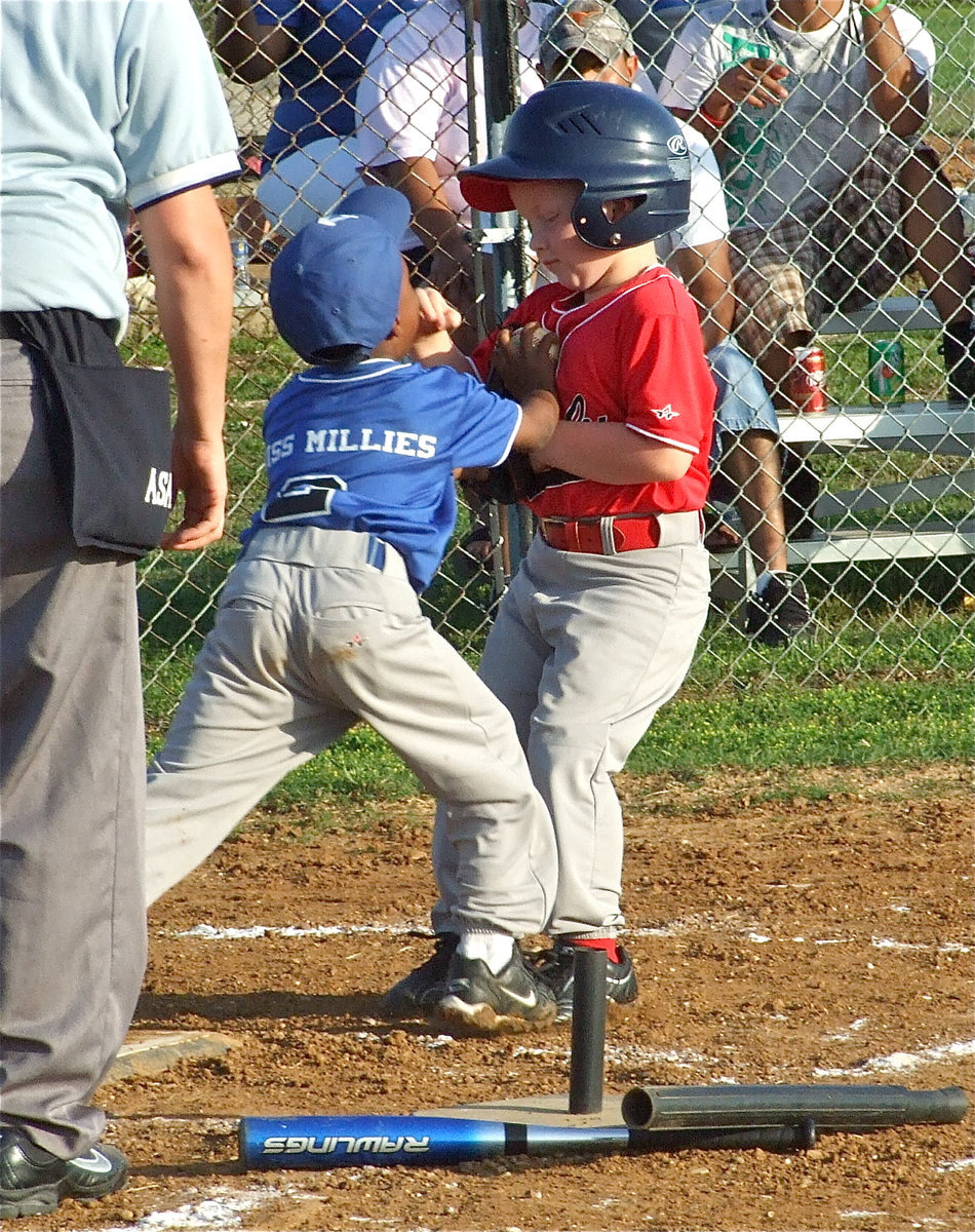 Image: Small collision — T-Ballers play like the big boys.