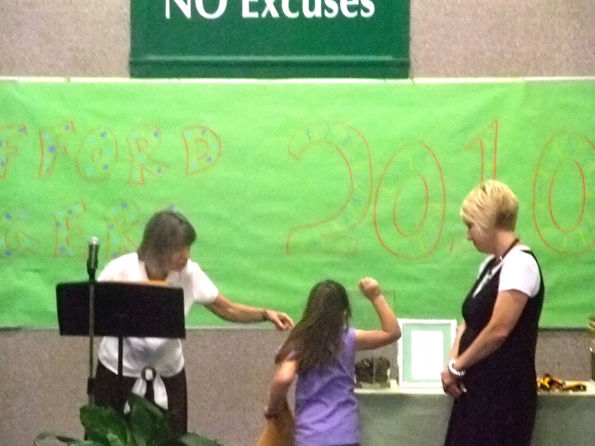 Image: Throw that marble in — This student was going to make sure her marble made it in the jar.