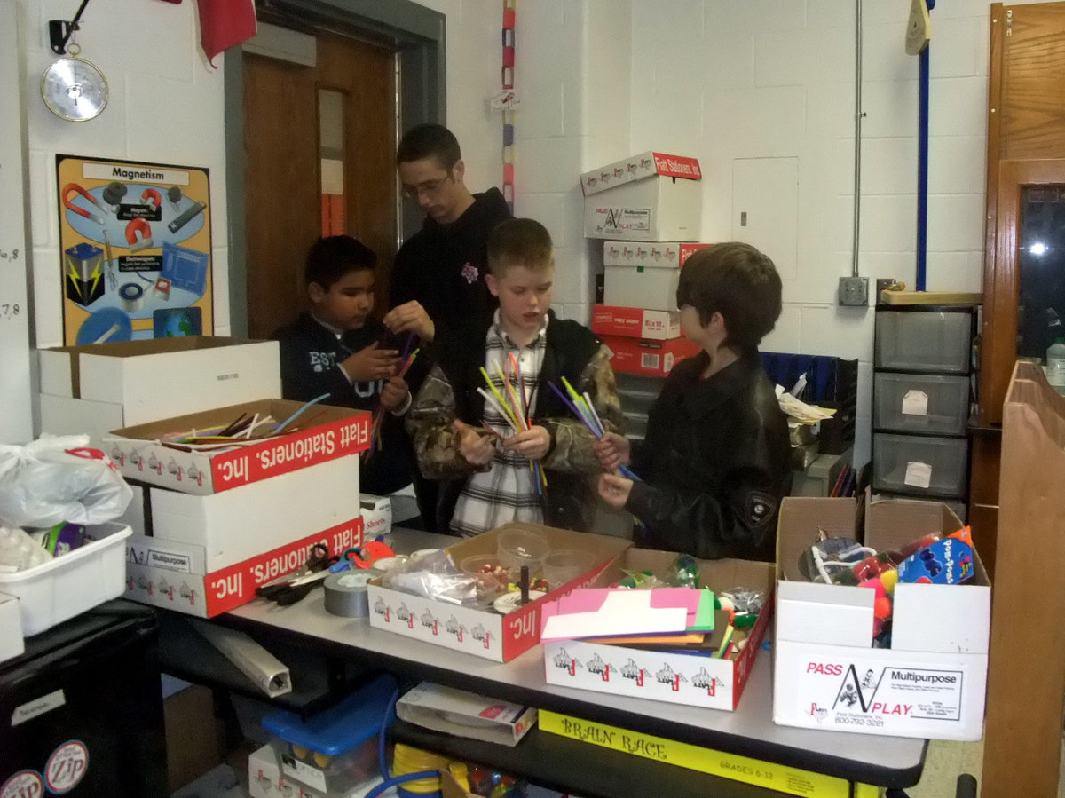 Image: What Color Pipe Cleaners? — The boys are busy picking out colored pipe cleaners for their Jitterbug legs.