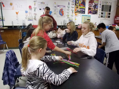 Image: Selecting Pipe Cleaners — These girls are ready to make their Jitterbug’s legs.