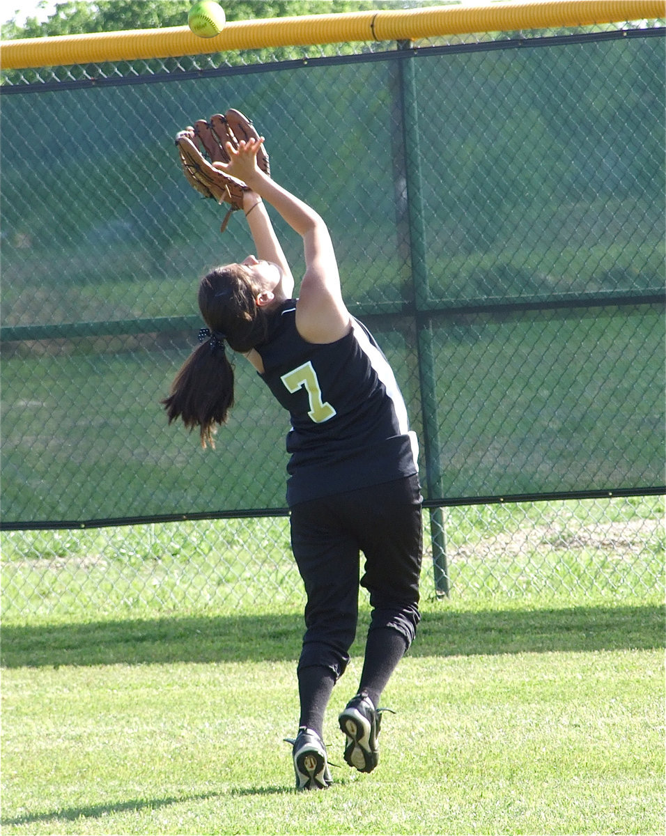 Image: Lucky 7 — Alma Suaste attempts an over the shoulder catch during warmups.