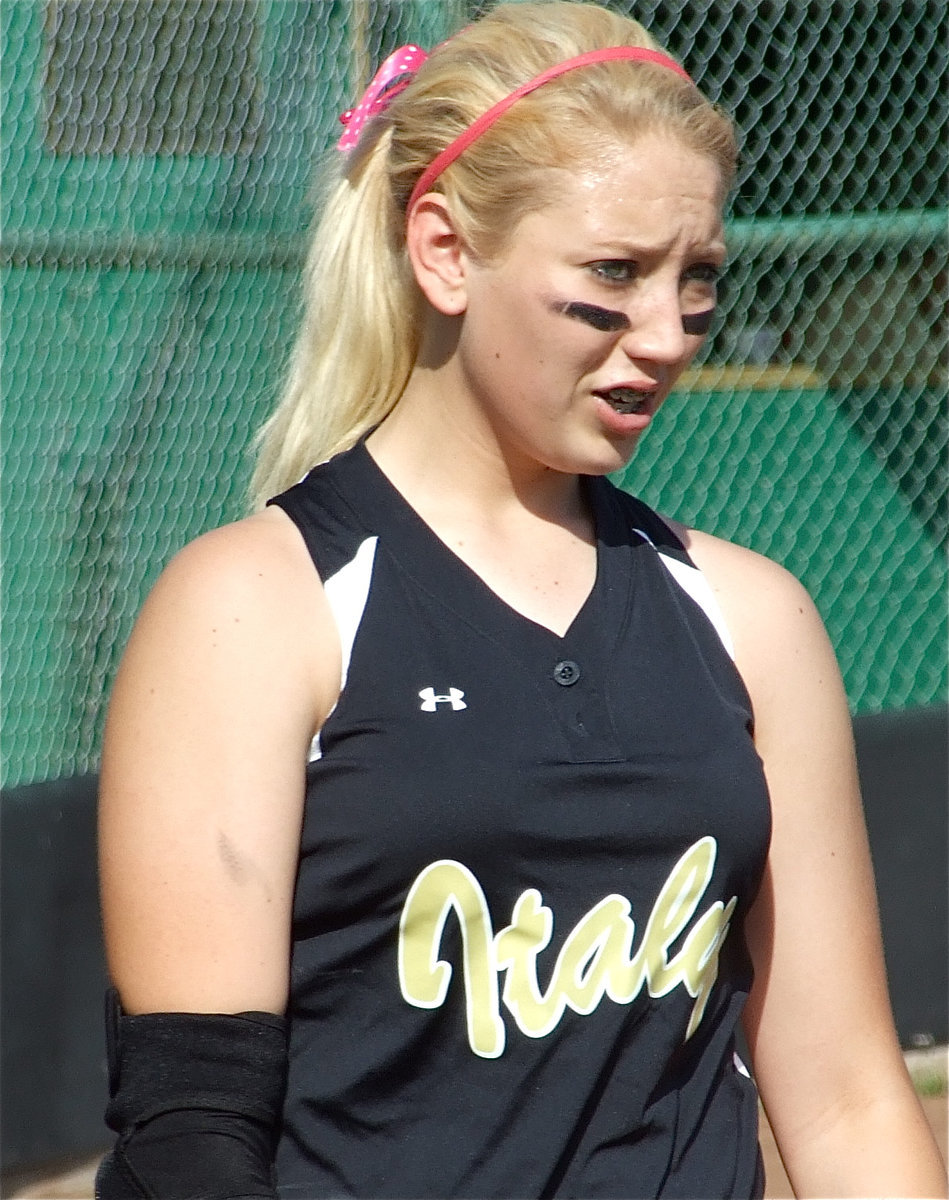 Image: Megan warms up — Megan Richards warms up her pitching arm before the game against Frost. Fortunately, she was able to keep it rested with senior Courtney Wesbrook able to pitch the entire game.