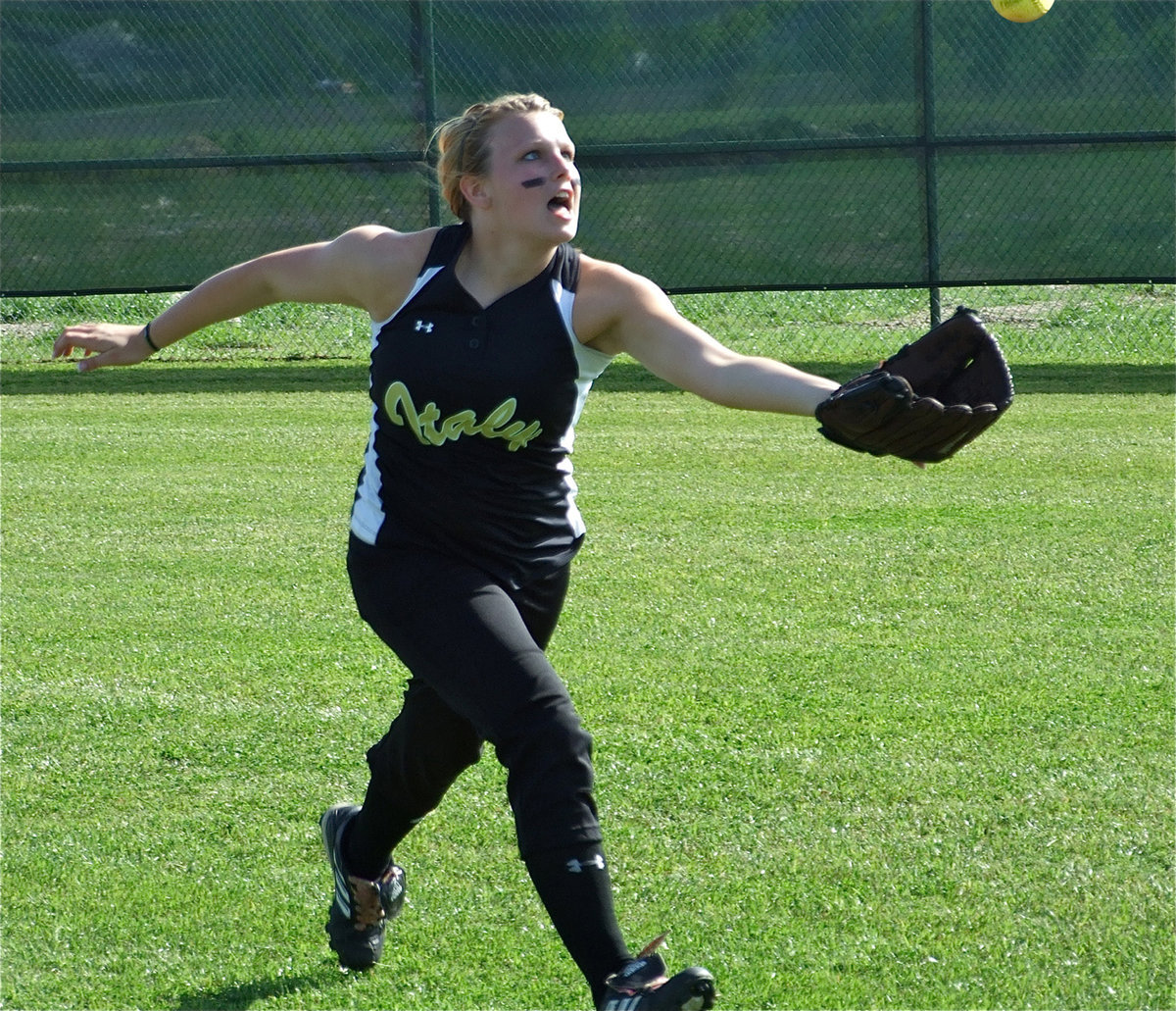 Image: Casi hustles — Casi Jeffords gives 110% going after a blooper during the pre-game.