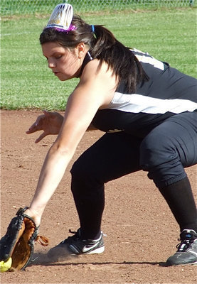 Image: T-a-l-e-n-t-e-d — Senior Cori Jeffords backhands a grounder during the pre-game warmups.
