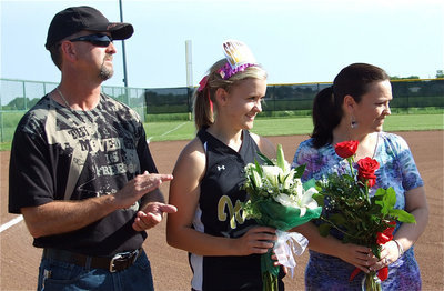 Image: Proud parents — Courtney Westbrook stands with her parents, Kelly and Angie, during the Senior Day introductions.