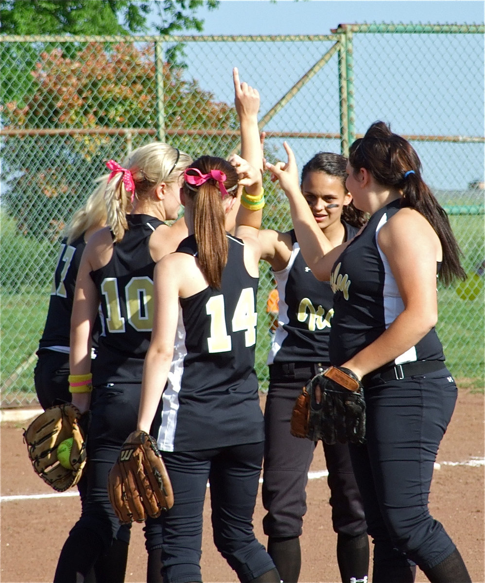 Image: Infielders feeling good — The Lady Gladiators are feeling good about their performance during the Frost game.