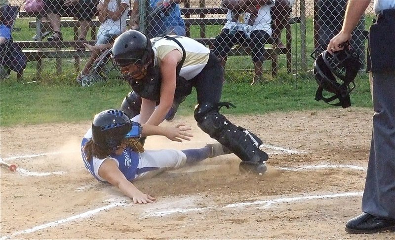 Image: Heather Bledsue gets the out for the IYAA 15u girl’s softball team — Catcher Heather Bledsue makes the tag at the plate for the IYAA 15u girl’s softball team. After splitting games with Itasca, Italy is currently in first place after winning the coin flip.