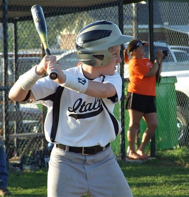 Image: John faces challenge — John Escamilla, off one of the two IYAA 12u boy’s teams, snarls at the opposing pitcher.