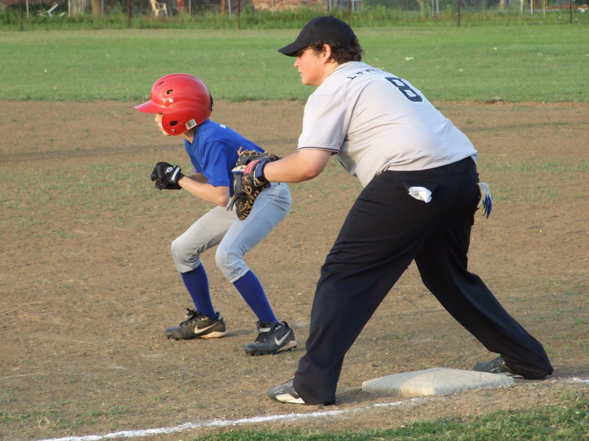 Image: Proportions are correct — John Byers covers first for the IYAA 14u boy’s team against Whitney.