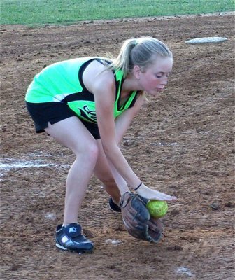 Image: Hannah uses both hands — Hannah Washington uses good technique fielding a grounder for the IYAA 12u girl’s softball team coached by Michael Chambers.