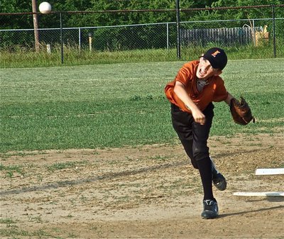 Image: A screaming pitch — Ty Windham screams in a strike for the IYAA 12u boy’s team head coached by Ken Norwood.