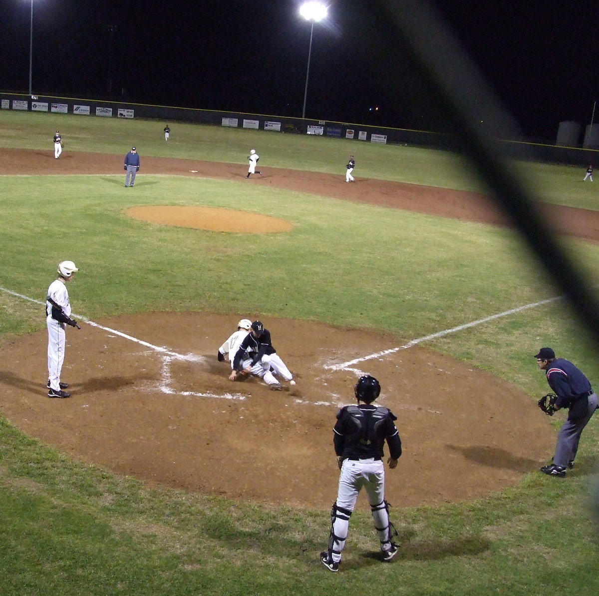 Image: Souder makes it in — Brandon Souder slides in to give Italy another run on the board.