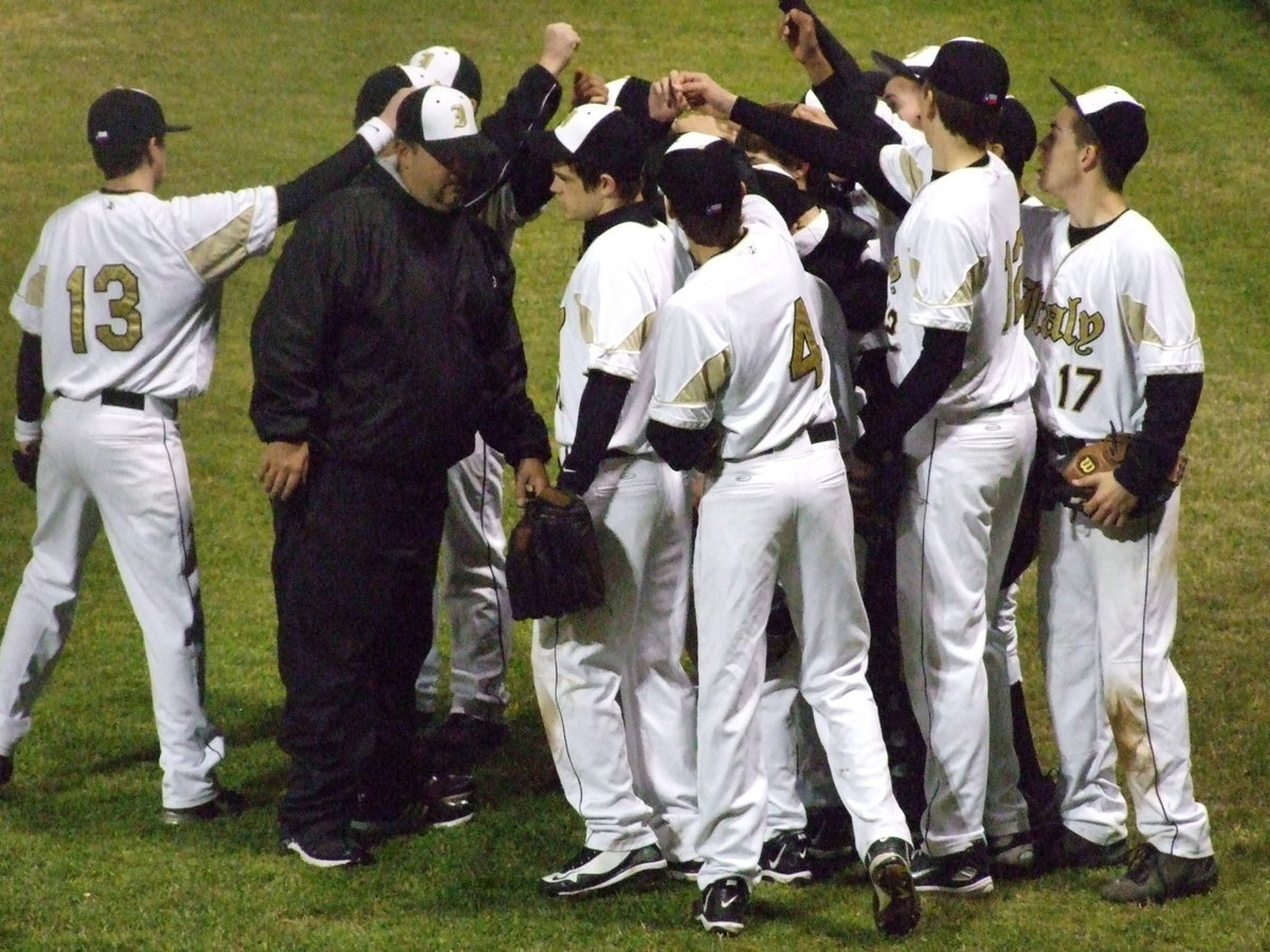 Image: Game time — The Gladiators huddle up in between innings.