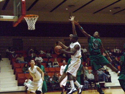 Image: Hanging Around — Italy’s #11 Jasenio Anderson hangs out with a couple of Kerens defenders on his way to the house.
