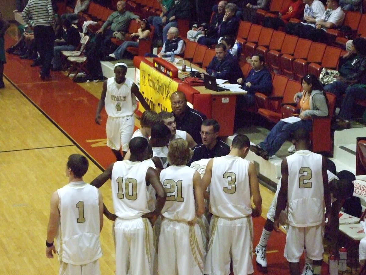 Image: Rally Time — Coach Kyle Holley encourages his squad late in the game.