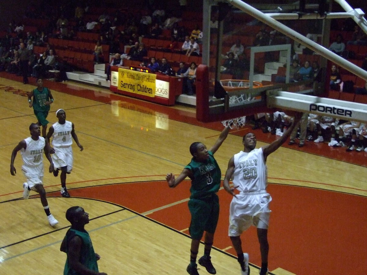 Image: Gaining Moore-mentum — High flyer #20 Darrin Moore takes off for the goal trying to grab the momentum for Italy.