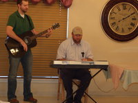 Image: Come Sing With Us — Keith Roberts and his son play Amazing Grace.