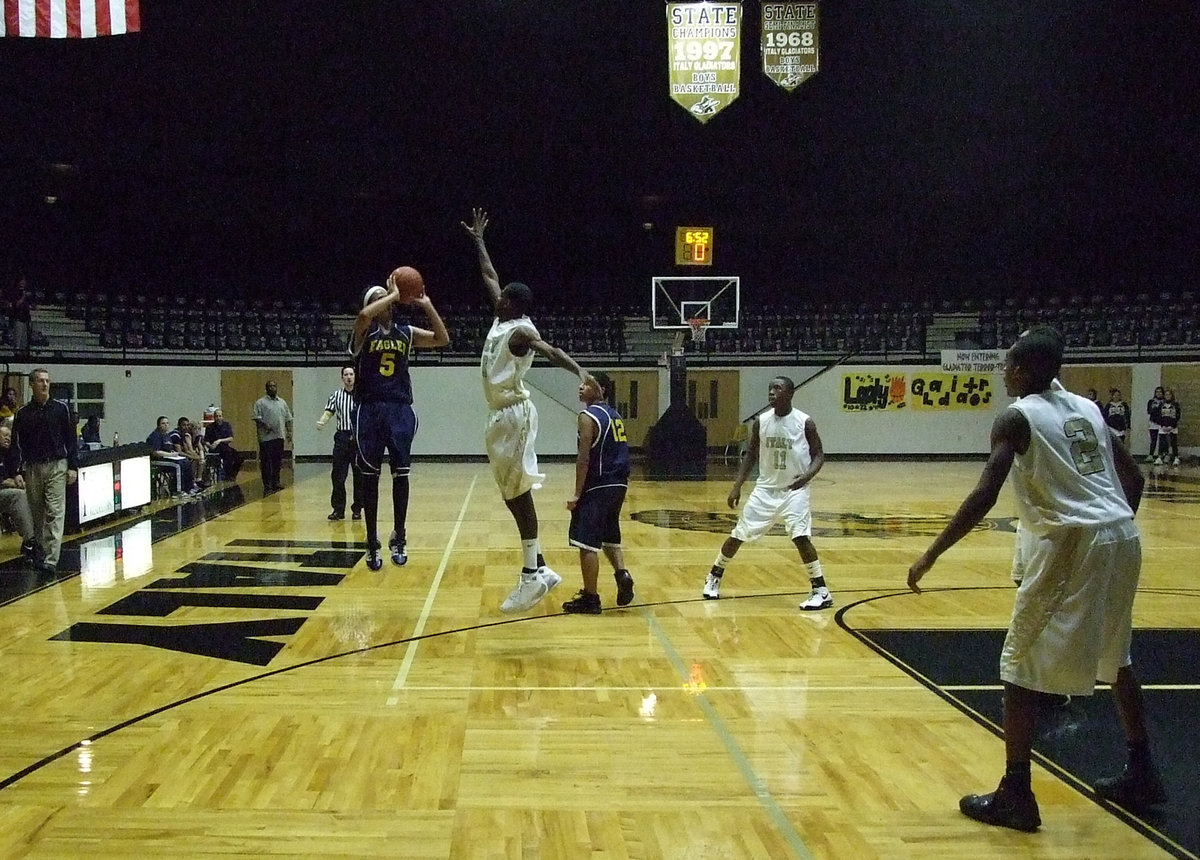 Image: Eagles can fly too — Grand Prairie’s Louis Salazar fights off the Gladiators defense.